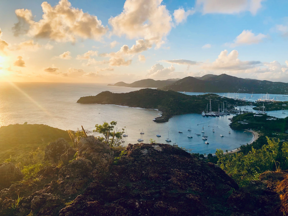 Sailboats in bay at golden hour